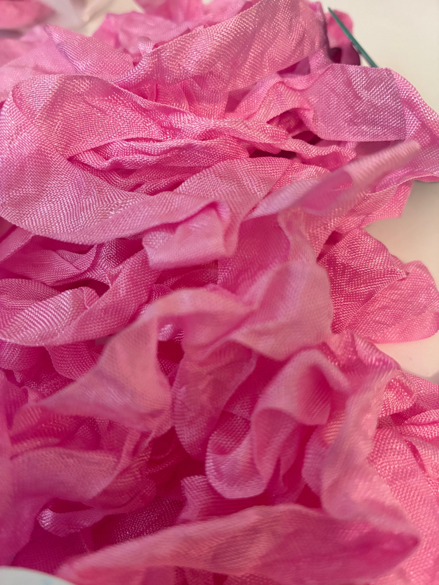 Pretty in Pink seam binding. 5-yards uncut crinkled seam binding in re-useable white mesh bags.