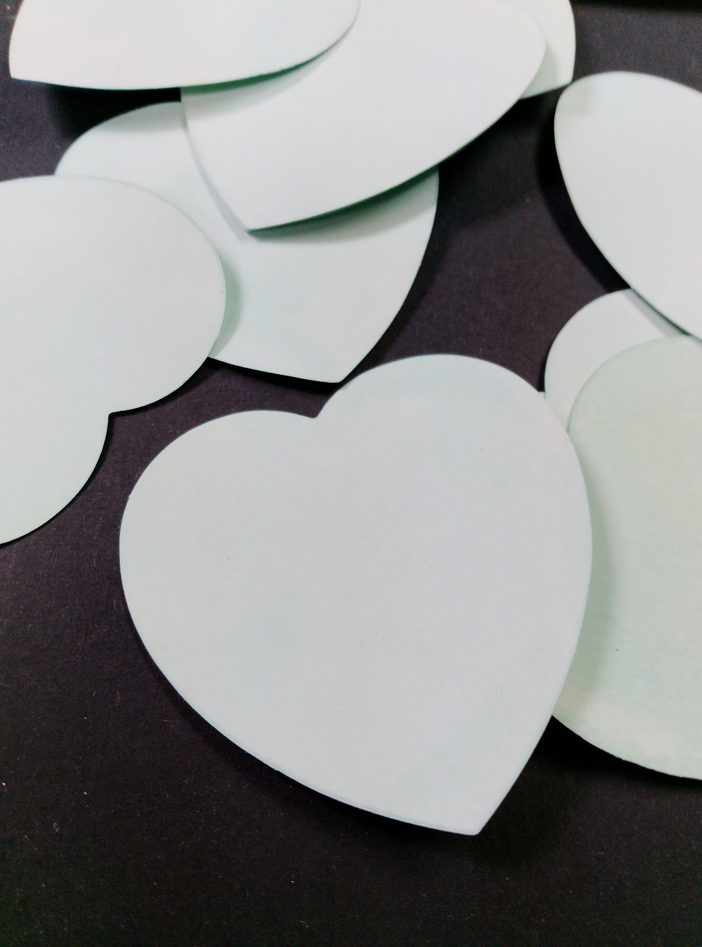 Hearts hand dyed in light shades of green. 20 pretty hearts per pack