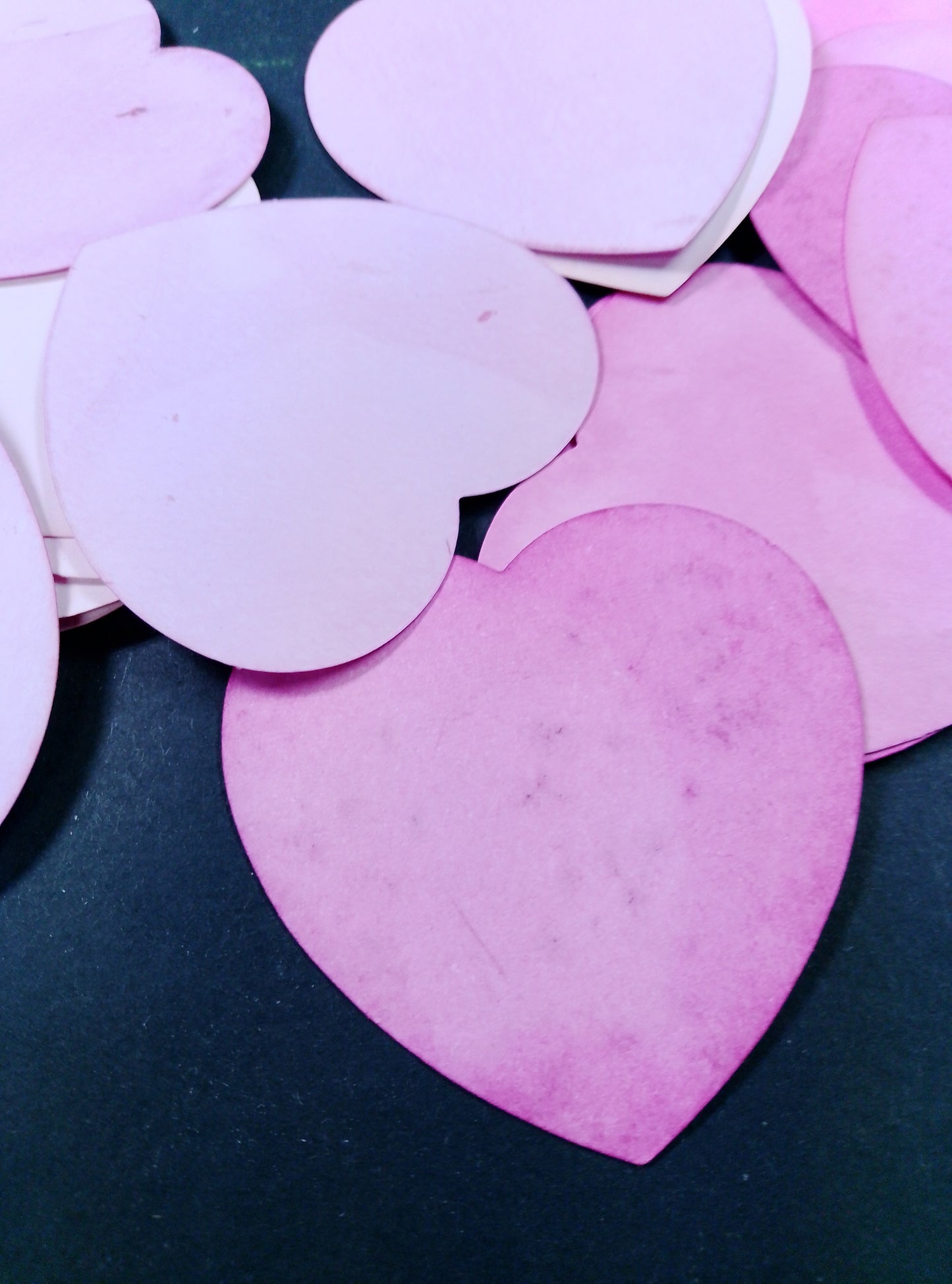 Hearts hand dyed in shades of pink. 20 in each bag