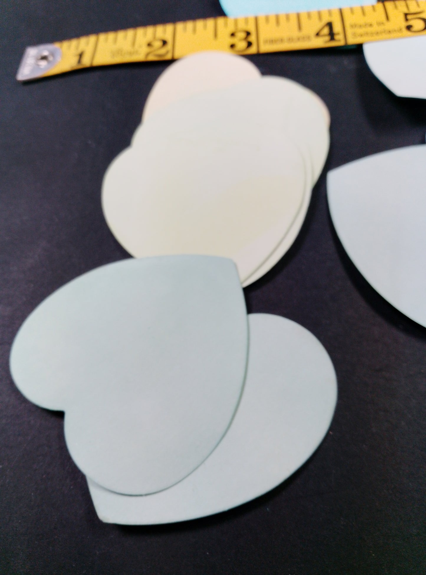 Hearts hand dyed in light shades of green. 20 pretty hearts per pack