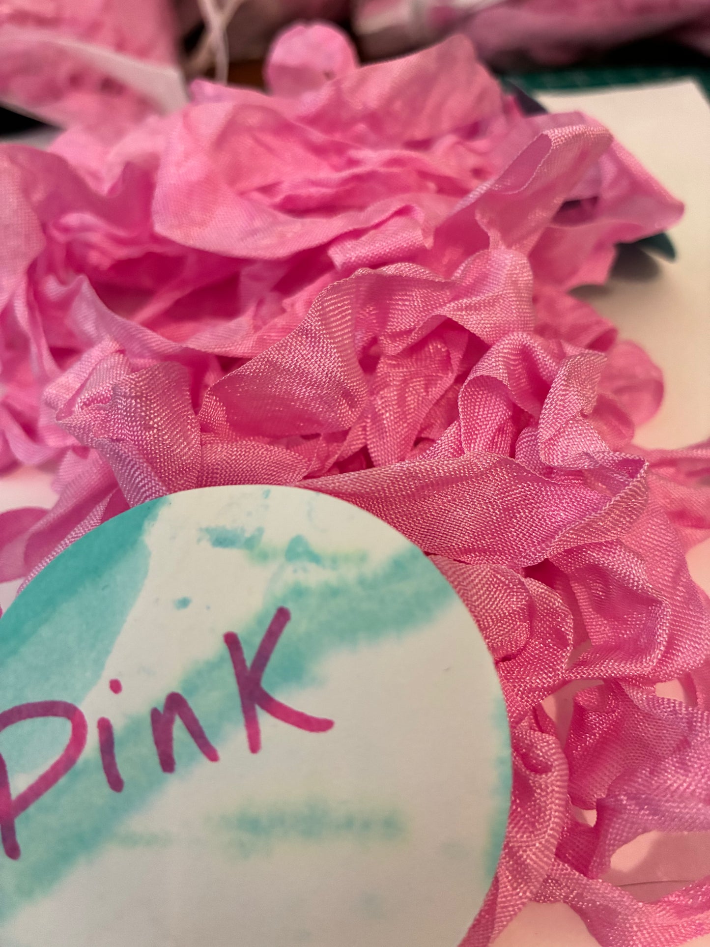 Pretty in Pink seam binding.  5-yards uncut crinkled seam binding in re-useable white mesh bags.