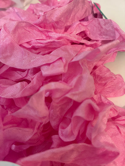 Pretty in Pink seam binding.  5-yards uncut crinkled seam binding in re-useable white mesh bags.