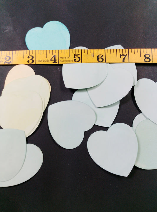 Hearts hand dyed in light shades of green.  20 pretty hearts per pack