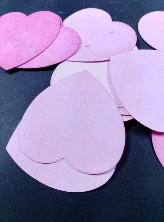 Hearts hand dyed in shades of pink.  20 in each bag